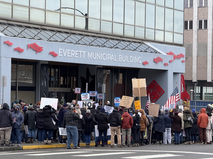 Roughly 60 protest Trump and Musk, call on elected officials