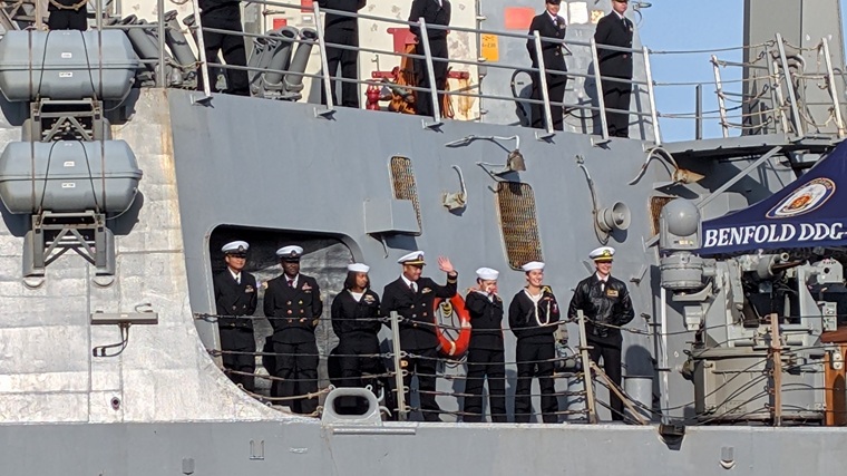 US Navy, sailor waves US Navy, sailor waves
