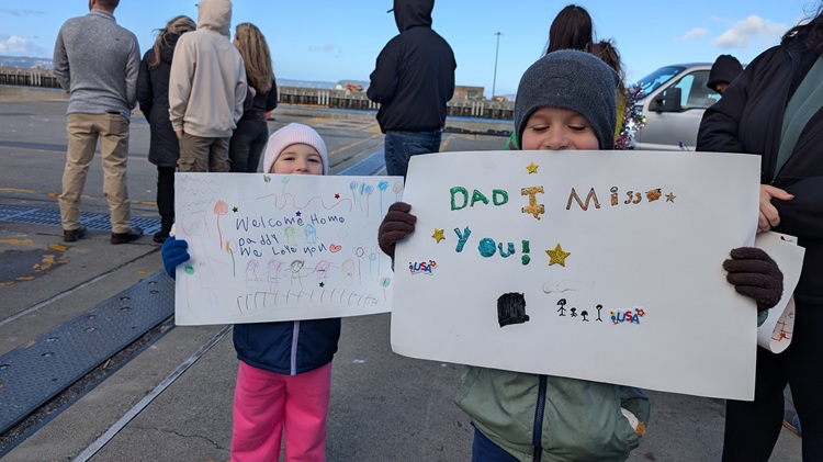 USS Gridley kids with signs